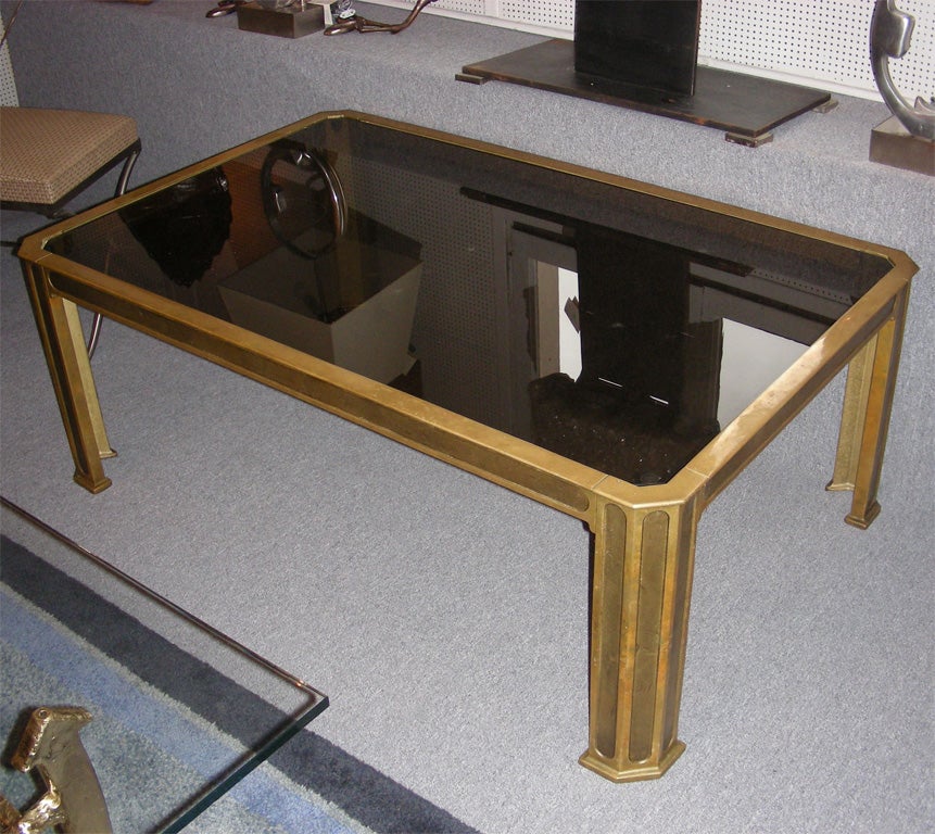 1970s coffee table by Van Heeck in gilt bronze with smoked glass top.