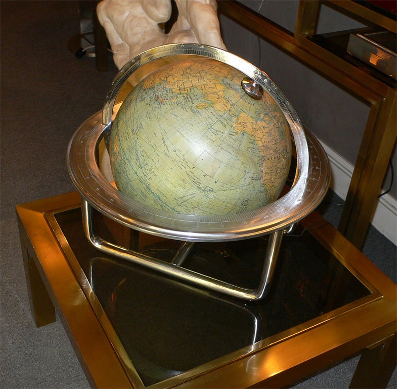 1930s terrestrial globe by Jacques Adnet in nickeled metal. Globe is lighted and can be oriented.