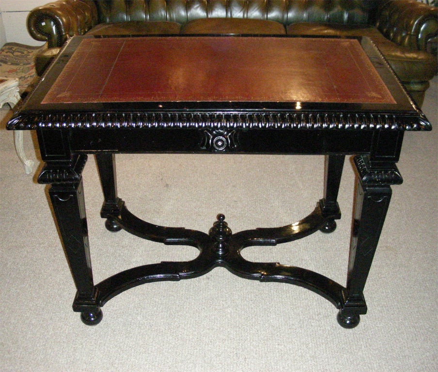 Napoleon III desk, Louis XIV style, in wood stained black onto the original lacquer. Restored leather top.