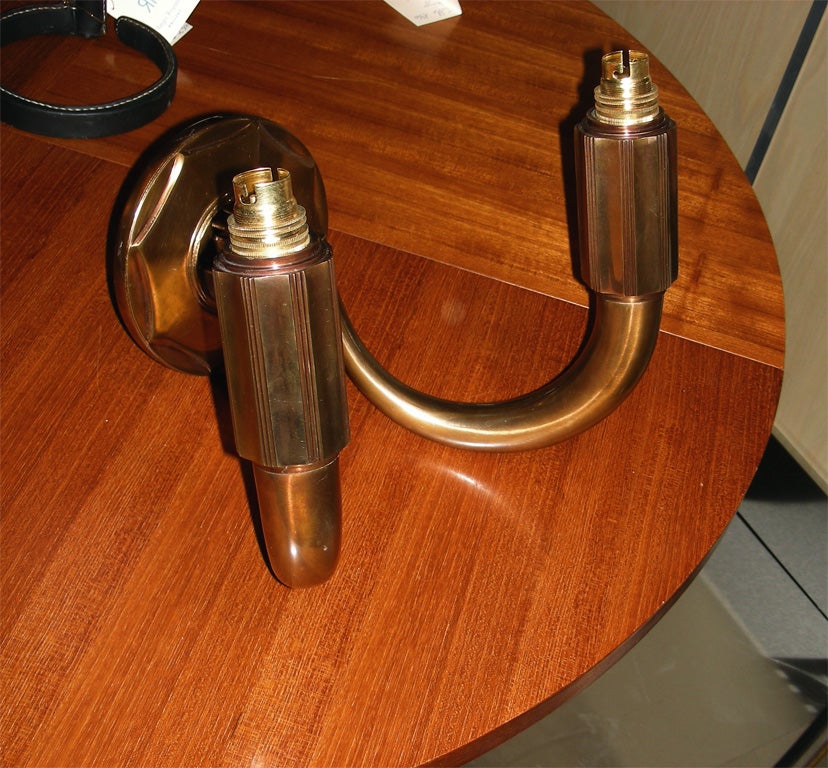 Two 1930s sconces in the style of Jacques-Emile Ruhlmann, with two arms.