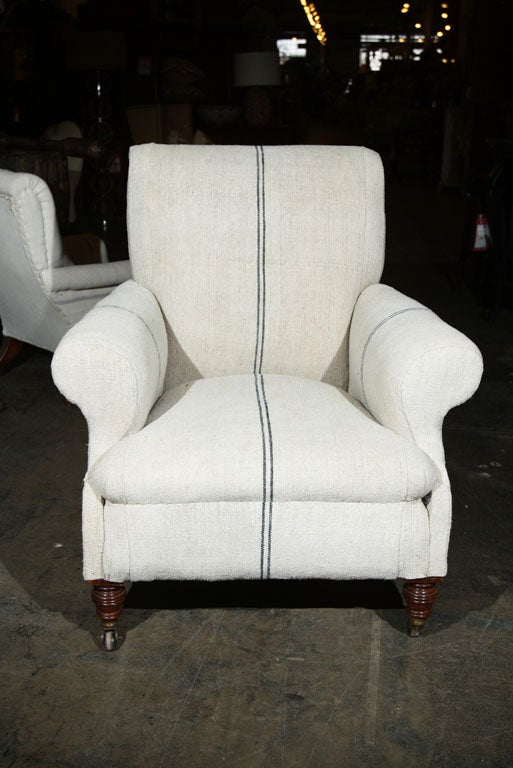 club chair covered in hand-spun linen on orginal casters
