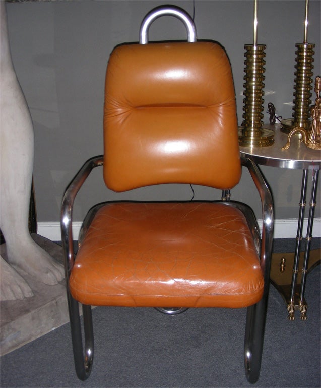 Two 1971 armchairs by Kwok Hoi Chan for Steiner with structure in chromed metal. Back-rest and seating in tan leather.