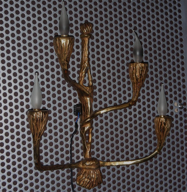 Two 1950s gilt bronze sconces with four lights, in the style of Felix Agostini.