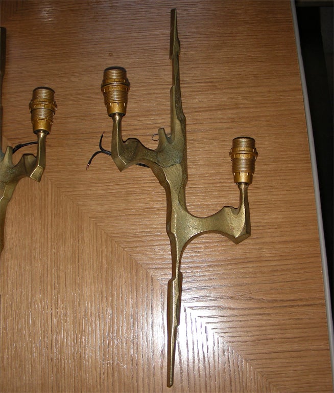 Two 1960s gilt bronze sconces with two lights, in the style of Felix Agostini.