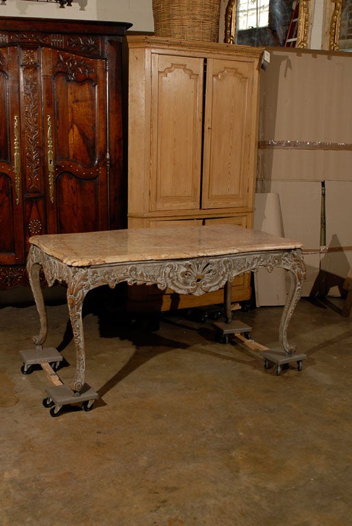 A 19th century French Regence style painted console/center table with a marble top, pierced carved frieze with shell on all four sides and cabriole feet.

For many more fine antiques, please visit our online gallery. William Word Fine Antiques: