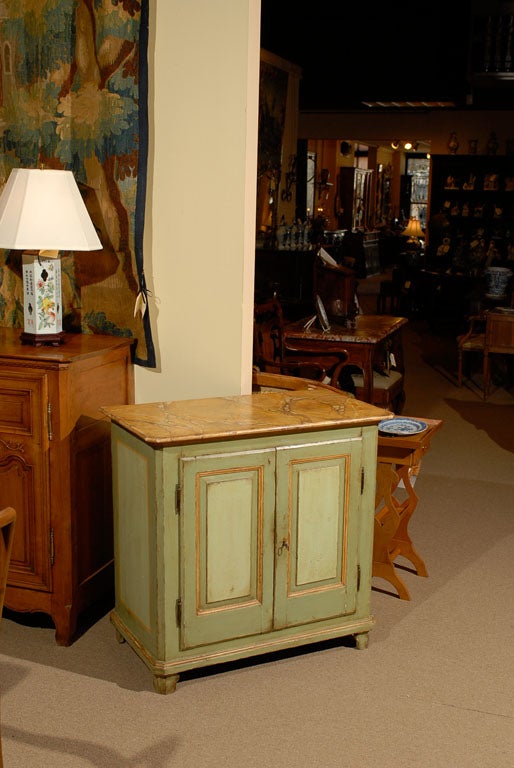A Provincial Green & Ochre Painted Buffet with 2 Cabinet Doors and Faux Painted Marble Top, dating from the early 19th century and French in origin.


