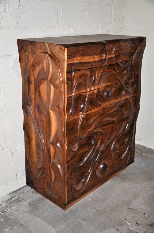 Solid black walnut dresser with carved out elements.