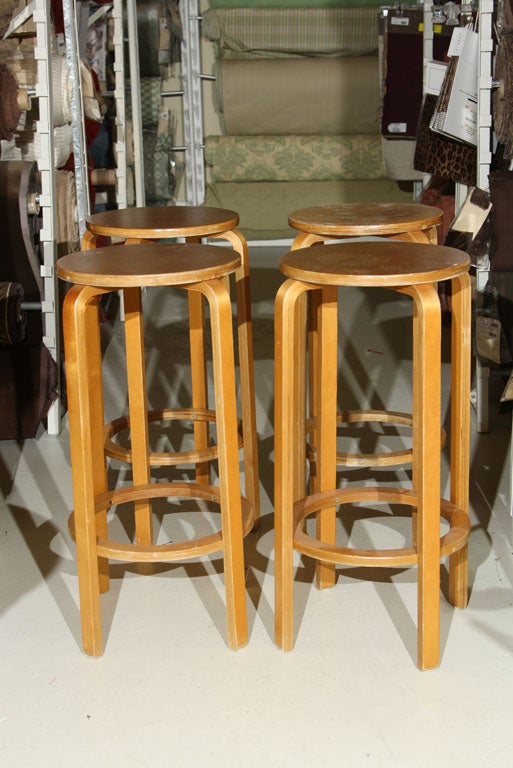 FOUR LAMINATED  BIRCH STOOLS.MODEL #63 CIRCA 1930'S- CLEAR NATURAL BIRCH  FINISH- STOOLS  HAVE  BEEN  REFINISHED AND  ARE  IN BEAUTIFUL CONDITION.