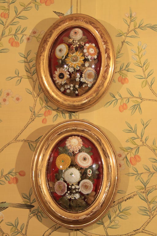 Breathtaking bouquets of flowers made completely of shells on a wonderful red background.  Lovely gilded Louis Philippe frames with domed glass.  Very decorative and unique.