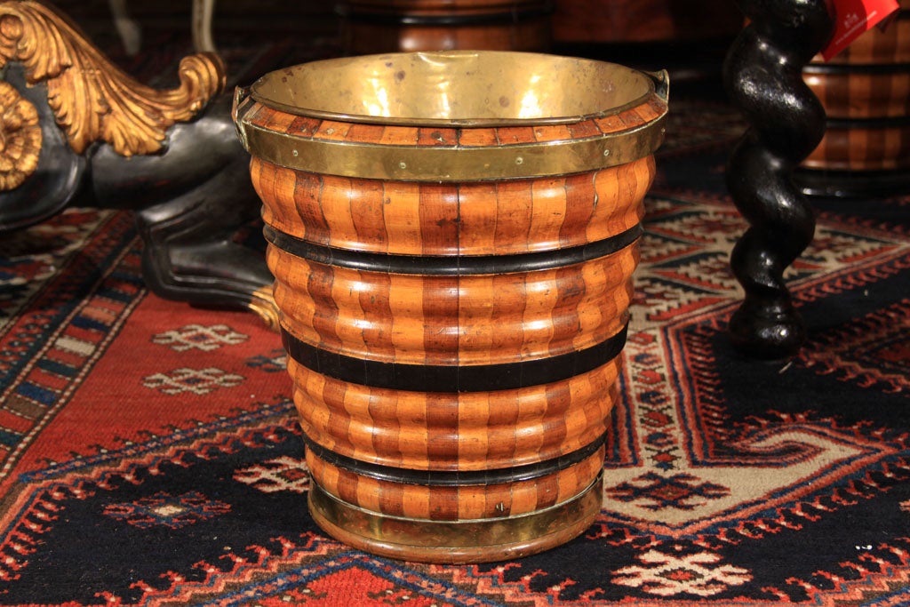 Wonderful 19th century peat bucket with brass liner. This piece would make wonderful vessel for dried flowers or even a waste basket. It is very substantial and the wood is beautiful