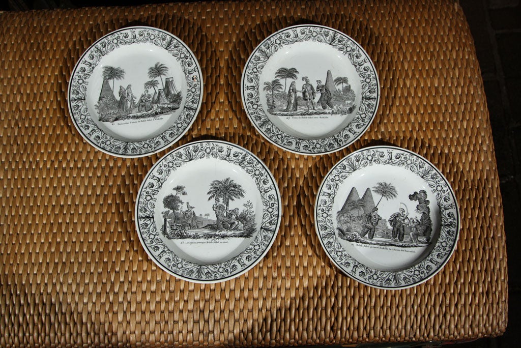 Set of four black and white French Creil plates depicting exotic scenes.