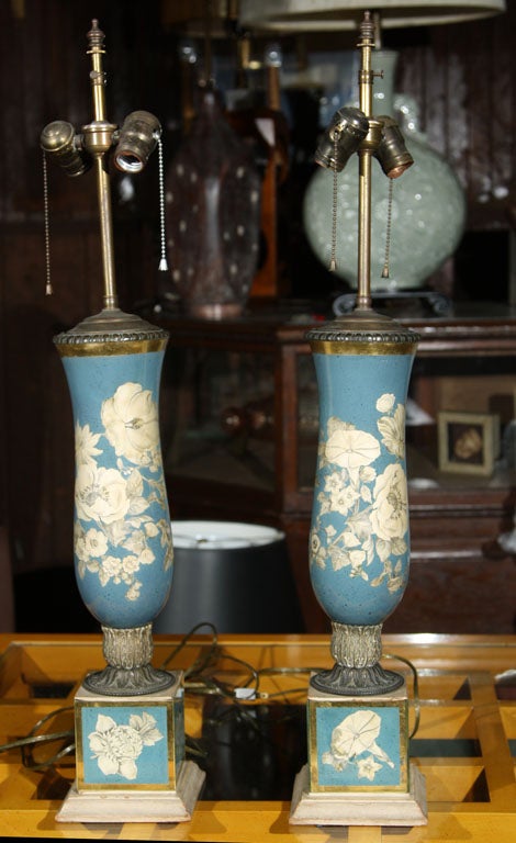 A pair of blue and off, white floral églomisé columnar lamps. Lamp body without rod is 20