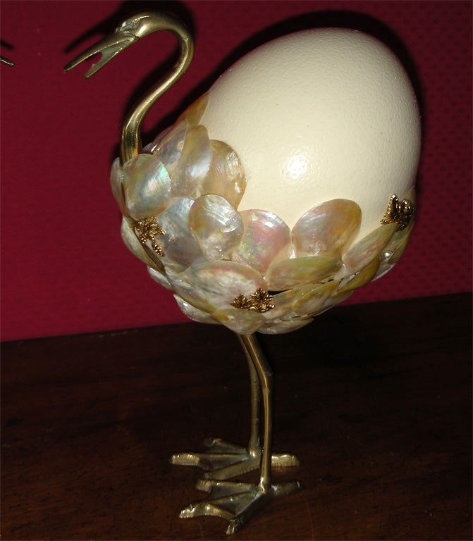 Two 1990s ostriches by Frédérique Lombard Morel with gilt metal legs, neck and head, shells to suggest feathers and ostrich egg suggesting the body.