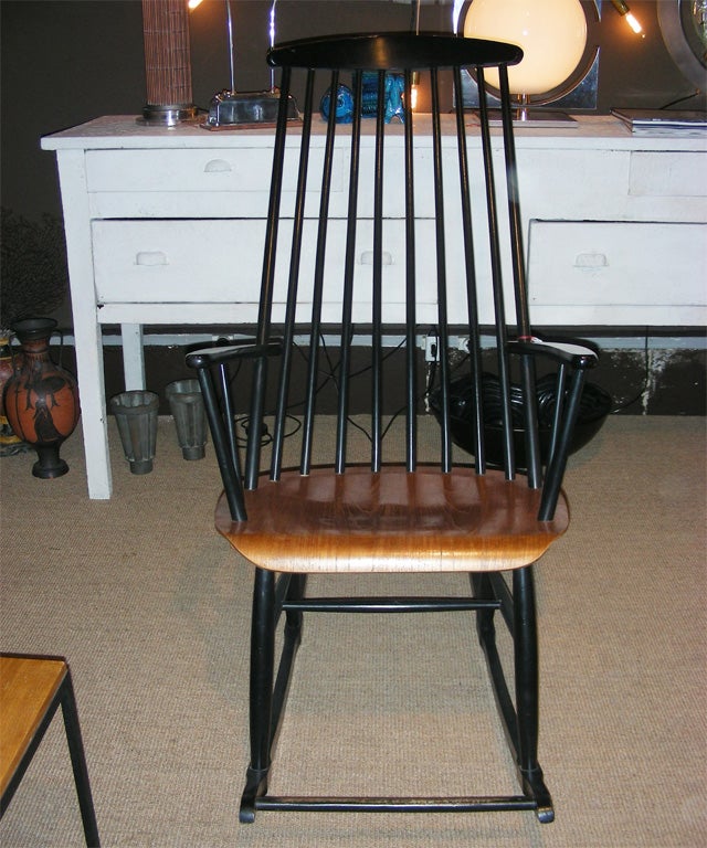 Two 1960s rocking chairs by Ilmari Tapiovaara in black lacquered wood.