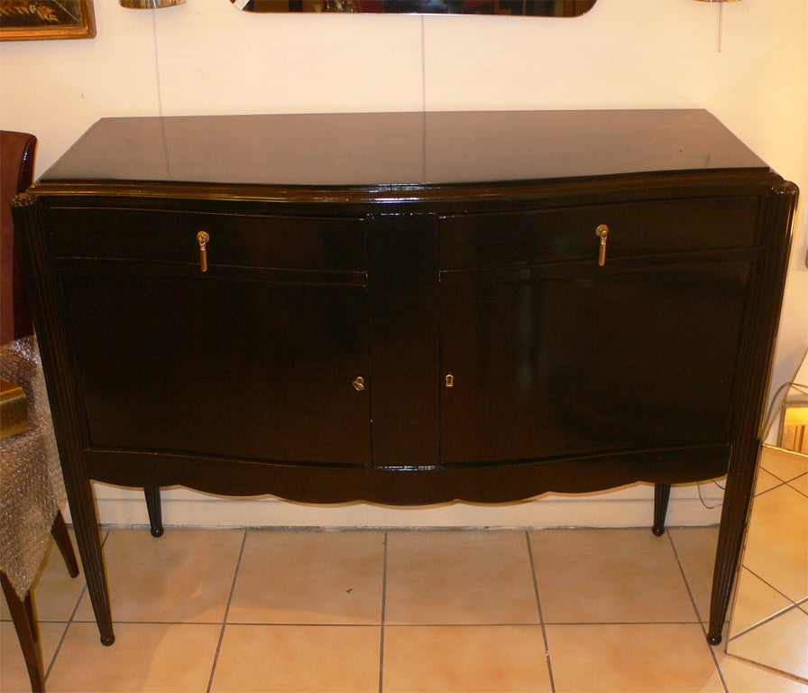 1920-1930 Buffet in black lacquered wood, with two drawers and two doors; scalloped apron.