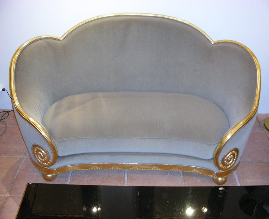 Circa 1925 canapé by Paul Follot re-upholstered in taupe velvet with wood structure in gold-leaf carved wood