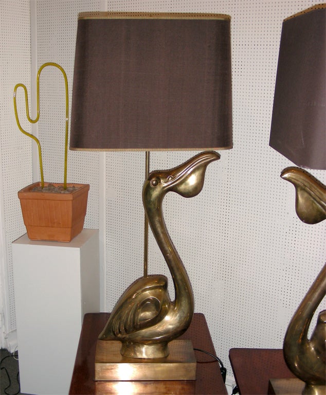 Two 1970s gilt bronze pelican lamps signed by Chervet and numbered 28/60, with two lights.
