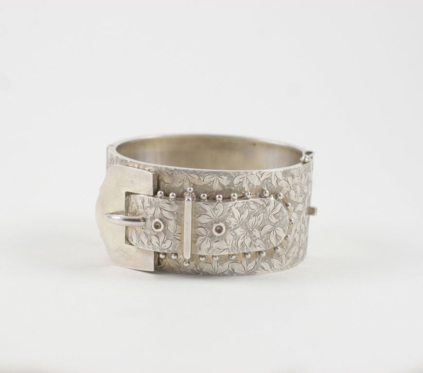 The buckle motif or dog collar was high fashion during the victorian period and often seen in sterling silver after 1850. Silver jewelry was once again a la mode.   Citizens other than royalty were able to purchase jewelry due to the spread of