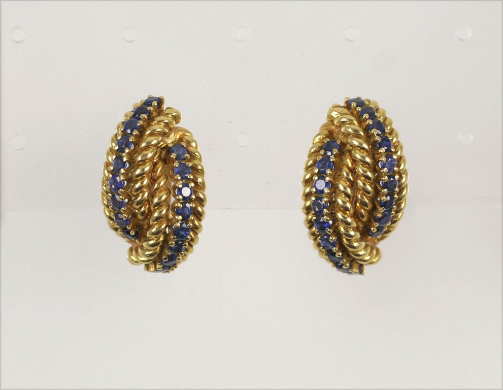 Pair of Elegant 18kt Yellow Gold Rope Earrings set with faceted Sapphires.  Very well made & substantial in their simple elegance. Signed 18Kt.  Can be coverted to pierced