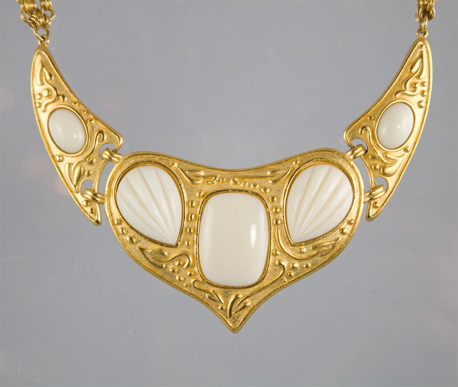 The YSL faux ivory and matte gold necklace measures 16 1/2