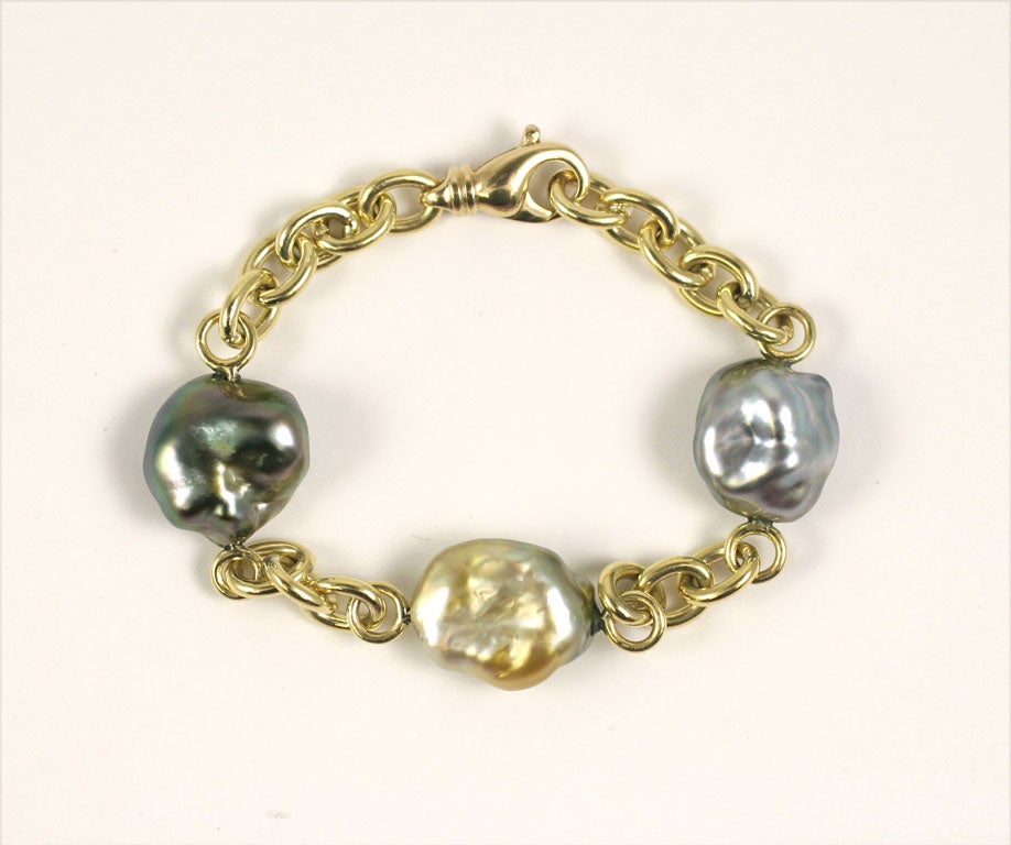 Extraordinary size and color for these 3 keshi pearls from Fiji. Classic oval and round link chain makes this perfect for everyday wear. Bold yet versatile.