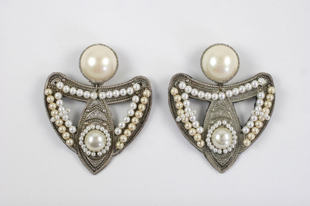 Large exotic silver and faux pearl earrings.