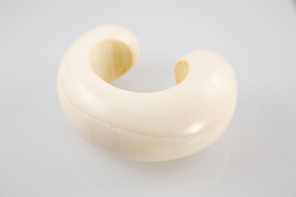 Fantastic carved Ivory cuff with a beautiful patina. Von Musulin's signature is etched into the ivory on the inside.