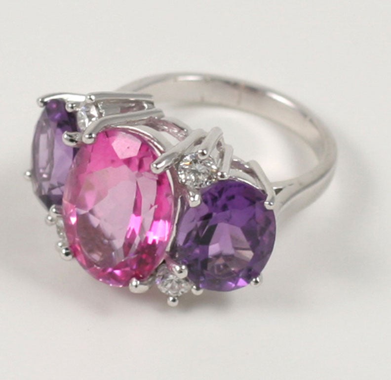 Large 18kt white gold GUM DROP™ ring with pink topaz (approximately 8 cts), amethyst (approximately 5 cts each), and 4 diamonds weighing 0.48 cts.

Specifications: Length: 15/16" Width: 5/8"
Other stone combinations available.

The