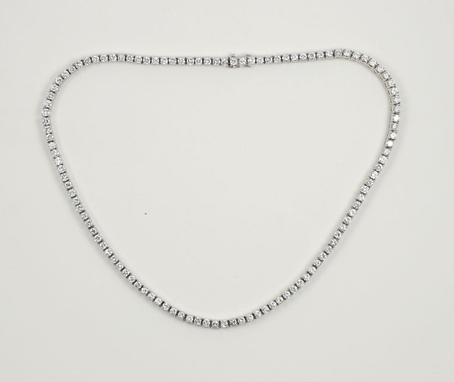 A classic Cartier riviere necklace set with 111 diamonds, weighing 11 atw, in platinum.  Each diamond weighs approximately .10 cts; Color: F-G , Clarity 'VVS-VS'