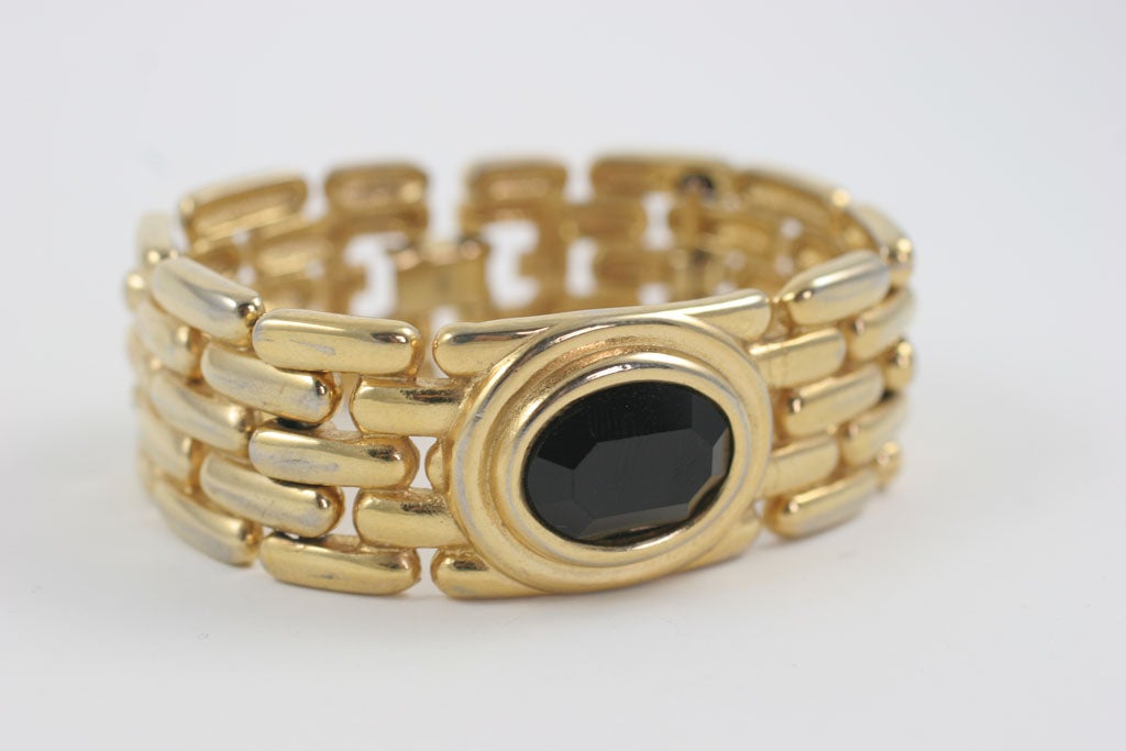 Goldtone linked bracelet set with a large faceted black oval 