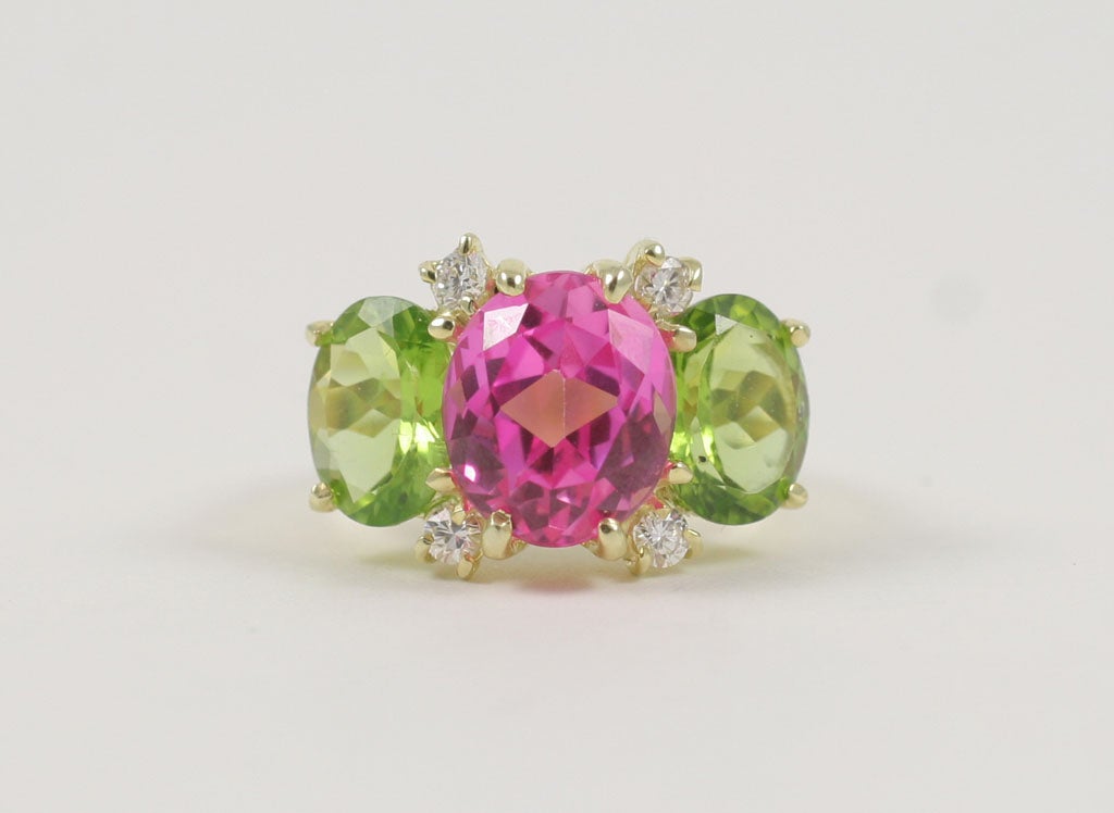 Medium 18kt yellow gold GUM DROP™ ring with pink topaz (approximately 5 cts), peridot (approximately 4 cts each), and 4 diamonds weighing 0.48 cts.

Specifications: Length: 7/8