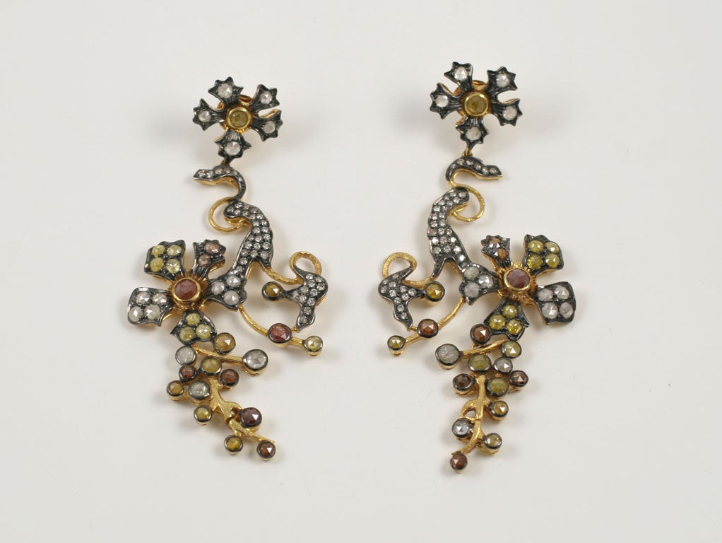 A pair of 18kt yellow gold,sterling silver and fancy diamond earrings.