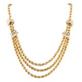 Gold rope draped necklace
