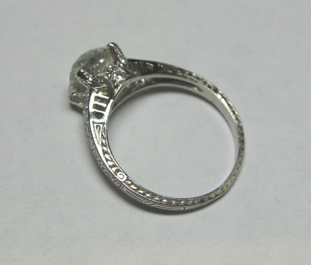 Platinum Art Deco Engagement ring with a 2.17 carat Old European Cut diamond, I-VS2 (EGL).  This beautiful mounting is set with 8 old european cut side diamonds weighing approximately 0.30 carats in total.  Circa 1920.