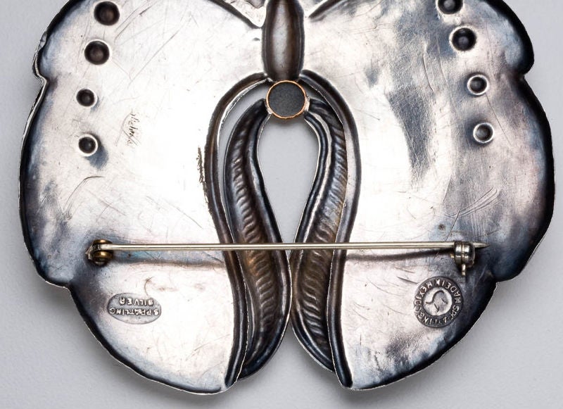 An exceptionally large brooch of a butterfly in sterling silver with bronze highlights by the master Mexican designer, William Spratling (b.1900 - d.1967).  Working in Taxco, Spratling was influenced by pre-Columbian motifs such as the butterfly,