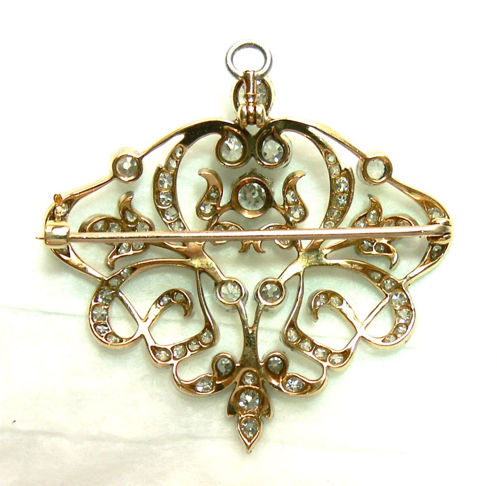 platinum topped yellow gold brooch set with numerous old European cut diamonds, total approximate weight 3 carats.