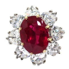 A ruby and diamond cluster ring.
