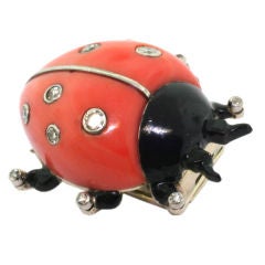 CARTIER. A black lacquer, coral and diamond ladybird brooch.