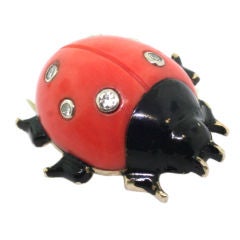 CARTIER. A black lacquer, coral and diamond ladybird brooch.