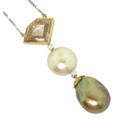 SYMBOLIC & CHASE. A Natural Pearl and Diamond Pendant.