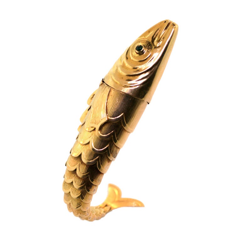 TIFFANY SCHLUMBERGER. A free standing gold cigarette lighter.