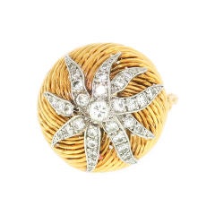 STERLE. A gold and diamond ring.