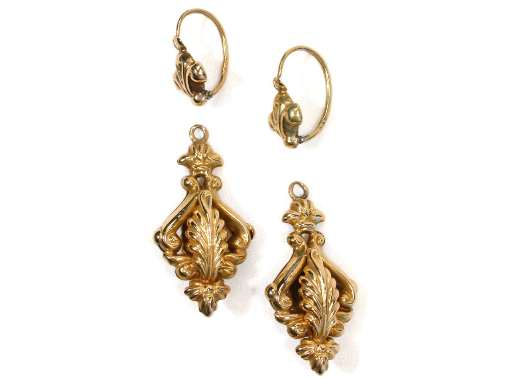This pair of late Georgian earrings has been rendered in warm tones of 18k yellow gold and decorated “en repoussé”.  One of the oldest metal working techniques, it is a process in which sheets of precious metal (usually gold) are hammered and shaped