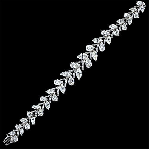 This extraordinary, finely crafted platinum bracelet from the 1950's - 60's, features 24 carats of high quality diamonds beautifully set in a slightly graduating vine motif with both pear shape and marquise shaped diamonds representing the leaves on
