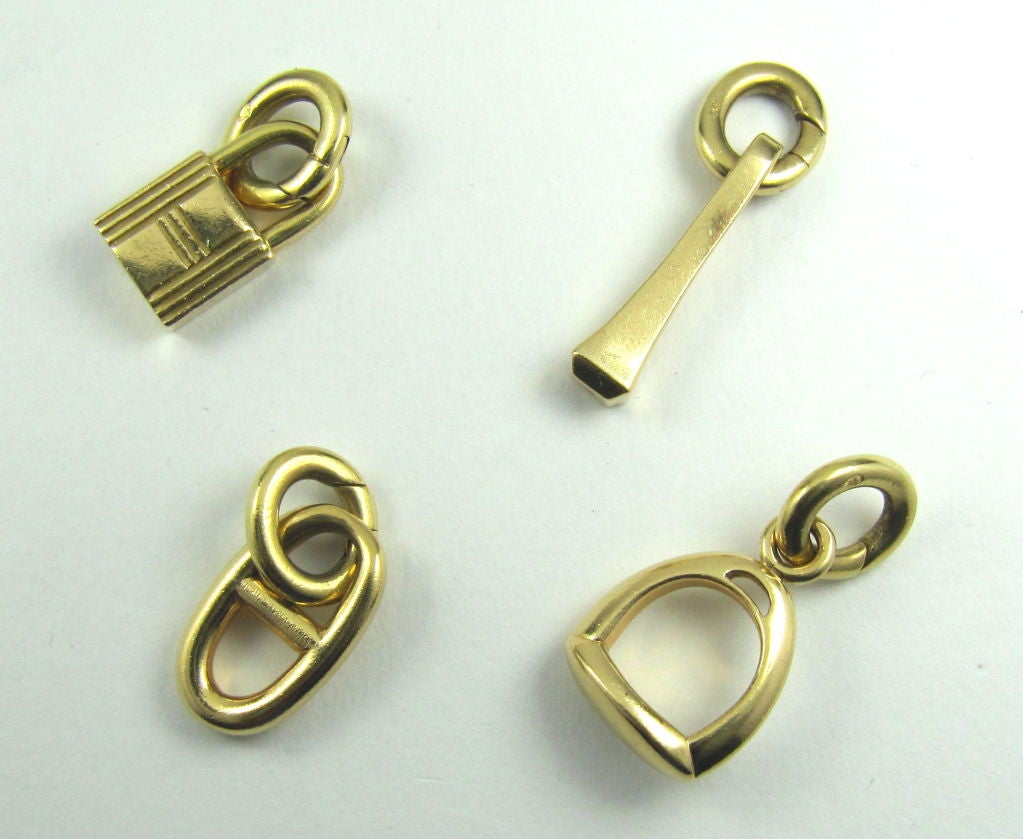 Women's HERMES 18K Gold 7-Charm Toggle Link Bracelet