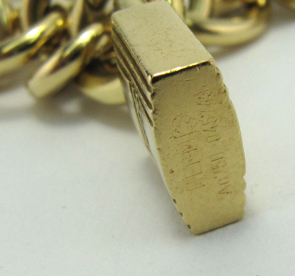 HERMES 18K Gold 7-Charm Toggle Link Bracelet 1