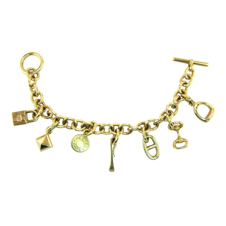 HERMES 18K Gold 7-Charm Toggle Link Bracelet