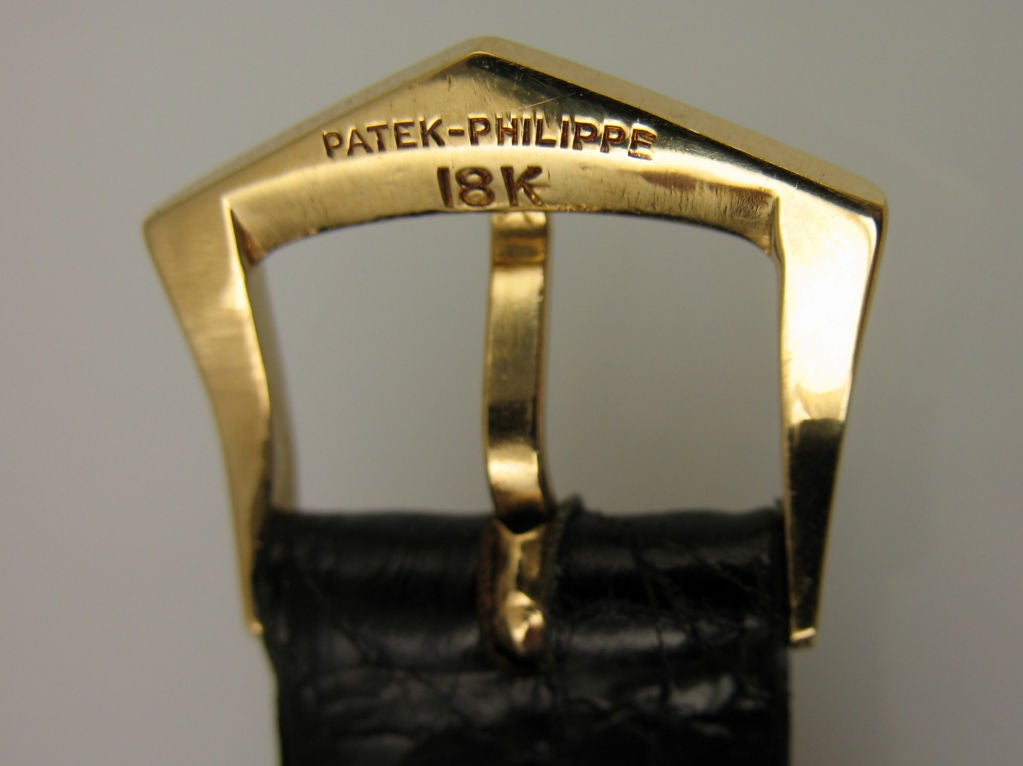 Patek Philippe reference 3893 in 18 karat yellow gold with an enamel face. Manual wind.
