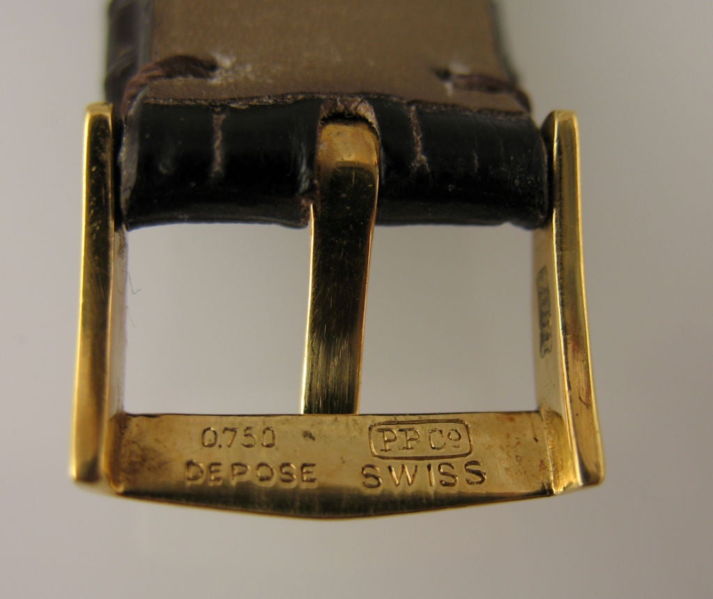 Patek Philippe square button chronograph ref. 130 in 18 karat gold.  c.1949  Original buckle. Archive included.