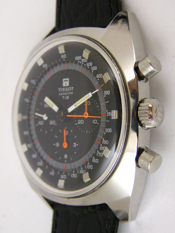 Tissot SS Seaster T 12 3 registers manual wind chronograph ref # 40506 oversize 42 x 50 mm cushion shaped case with sloped faced lugs circa 1960's. Black original dial with white and fluorescent orange details and orange chronograph hands. Wide